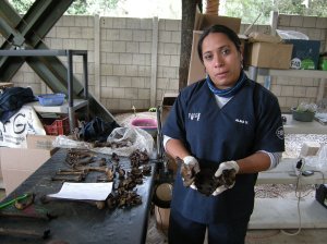 Alma Vasquez of FAFG explains signs of violent death among the human remains at La Verbena cemetery. Photo by Barbara Borst
